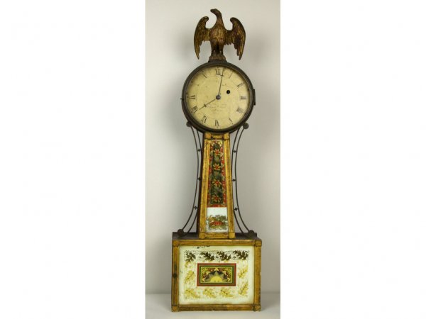 SIMON WILLARD EGLOMISE BANJO CLOCK: the roman numeral dial over an eglomise throat piece with foliate design marked "Patent", the lower eglomise panel with sun and foliate design, bronze eagle finial, 34x10x4in.