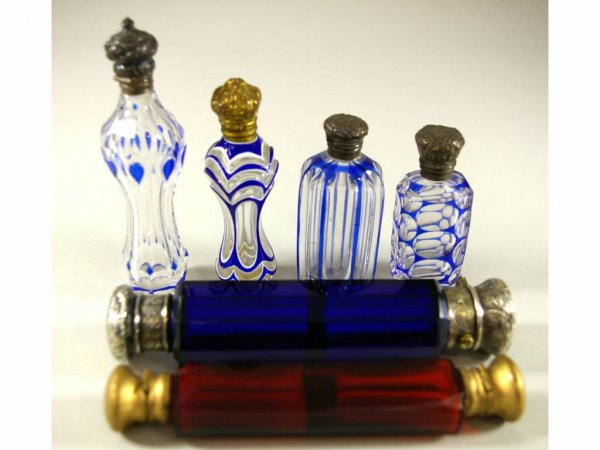 SIX SCENT BOTTLES: includes four blue cut-to-clear bottles and two double-end perfume flasks in ruby and cobalt, most with sterling caps