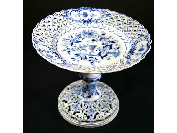MEISSEN BLUE AND WHITE PORCELAIN COMPOTE: in floral and foliate design with pierced rim and base, blue crossed swords mark, 7x9in.