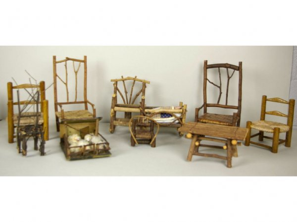 9-PIECE TWIG AND WOOD MINIATURE FURNITURE GROUP: including chairs, a nanny bench/cradle, a table, and a stable with sheep, breaks and losses, tallest 12in. The Knoop Collection