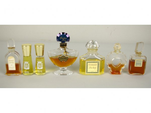 20 COMMERCIAL PERFUME BOTTLES: including Jean Patou, Lanvin, Guerlain including Jicky and Shalimar, Givenchy, Raphael Replique, Lancome Magie, Lalique (lid as is), etc., tallest 4in. The Knoop Collection