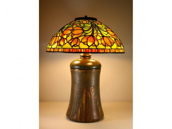 TIFFANY STUDIOS CROCUS LAMP ON ROOKWOOD BASE: Tiffany Studios Crocus leaded glass shade in green and yellow tones with rippled border, stamped metal tag on shade rim signed "Tiffany Studios New York", 16" diameter, the Rookwood pottery base signe