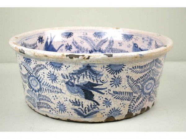 TALAVERA BLUE & WHITE TIN-GLAZED EARTHENWARE BASIN: in allover bird and foliate motif, the well with bishop's coat of arms and inscribed above "R.V.P.P. JUAN E LA SERNA", attached label on underside inscribed "Property of Duquesa de Cartaga", late 17th