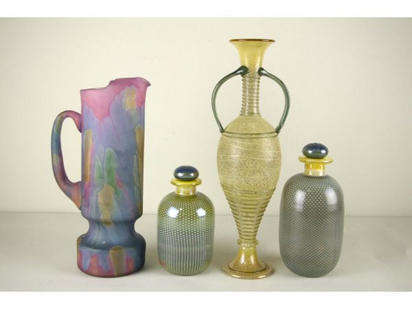 FOUR ART GLASS VESSELS: including a swirl glass two-handled vase, a multi colored pitcher, and two cologne bottles, tallest 15in.