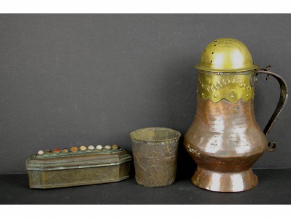 3-PIECE METALWARE GROUP: comprising a shaker, a tumbler with primitive-style figural decoration, and a scroll-decorated lidded box, tallest 9in. The Knoop Collection