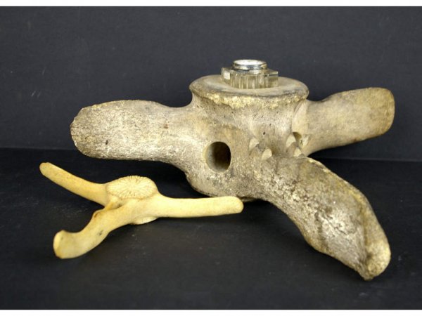 TWO WHALE BONE ITEMS: comprising two whale vertebrae, one fitted as an inkwell, largest 3.5x6in. The Knoop Collection