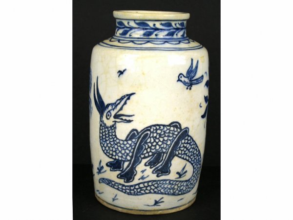 SLIP-DECORATED STONEWARE JAR: depicting a stylized lizard, birds and trees, 10in.