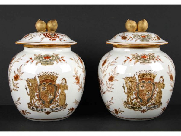 PAIR OF CHINESE PORCELAIN COVERED JARS: each floral decorated depicting Portuguese coat of arms, 11in.