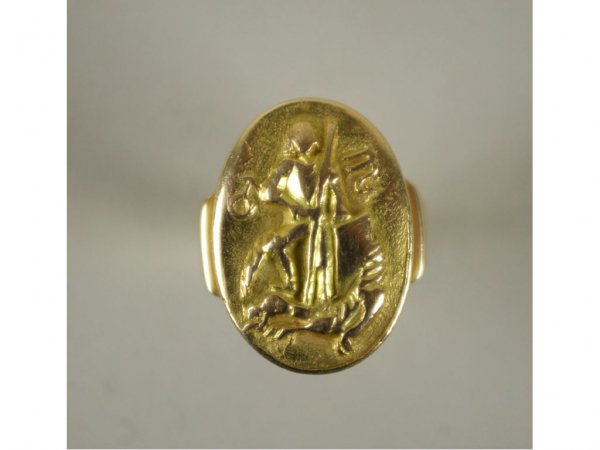 14K GENT'S MEDALLION RING: depicting a dragon slayer, yellow gold setting marked 585, 16.5gms.