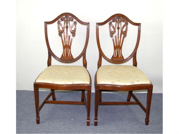 PAIR OF MAHOGANY SHIELD-BACK SIDE CHAIRS: in Hepplewhite style with bell flower, swag and floral decoration, signed Robert Blake of London