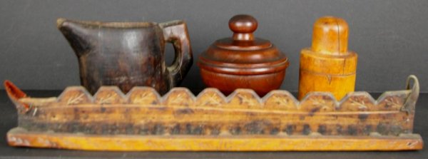 4-PIECE WOODENWARE GROUP: including a 19" wall hanging knife or utensil rack initialed JC, two covered jars, and a primitive carved pitcher The Knoop Collection