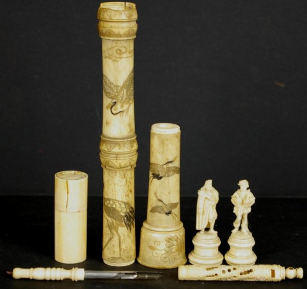 7-PIECE ASSORTED IVORY GROUP: comprising two carved game pieces, a perfume bottle holder, pen, and scrimshaw segments depicting birds in flight, largest 7in. Note: INTERNATIONAL SHIPPING IS NOT AVAILABLE FOR THIS ITEM. THIS ITEM W