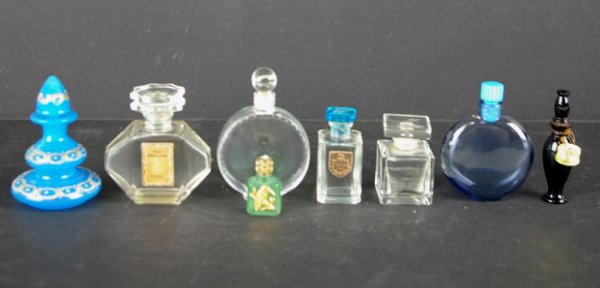 EIGHT COLOGNE AND PERFUME BOTTLES: French bottles include Lalique Worth, Bermuda Blue, Crepe de Chine by F. Millot, Frond by Vincent, and Lalique NR, Kohl by Elizabeth Arden, etc. The Knoop Collection
