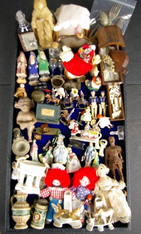 LARGE GROUP OF COLLECTIBLE MINIATURES: including bone dice, porcelain figures, 1939 World's Fair photo book, papier mache, carved wood dolls, steins, snow baby, match strike, Crystal Palace pin, lead soldiers, bisque, holiday, etc. The Kno