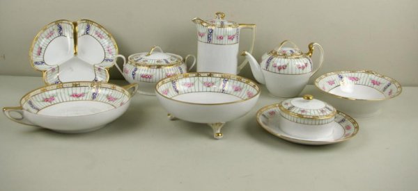 EIGHT NIPPON SERVICE PIECES: including a teapot, coffee pot, covered butter dish, footed bowl, etc.