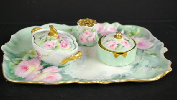 3-PIECE HAND-PAINTED LIMOGES DRESSER SET: includes an 11" tray, oval-form handled covered box, round-form covered box with insert, all marked "T&V / Limoges / France", together with an unmarked hat pin holder The Knoop Collection