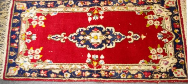 4.2x2 HAND-KNOTTED RUG: in beige and blue tones on red ground, Iran label