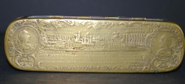 GERMAN BRASS TOBACCO BOX AFTER JOHANN KEPPELMAN: the lid depicting the battle of Rosbach (1757) flanked by portrait medallions of Frederick the Great and the French field marshall Prince of Soubise, inscribed with initials IADKMA and date 1757, the 