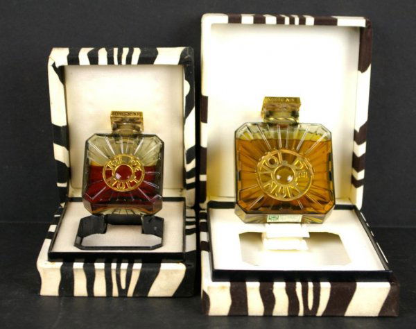 TWO GUERLAIN ART DECO VOL DE NUIT PERFUME BOTTLES: the larger example appears nearly full, the 1 oz. bottle about half full