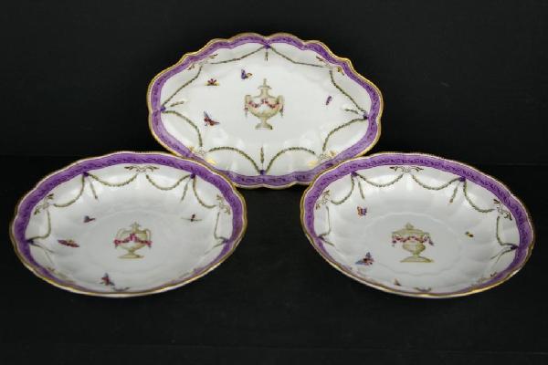 THREE ROYAL WORCESTER SERVING DISHES: each in urn motif centering butterflies, insects and floral swags, largest 10in.