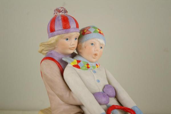 CYBIS FIGURE OF CHILDREN SLEDDING: 7.5x9in.