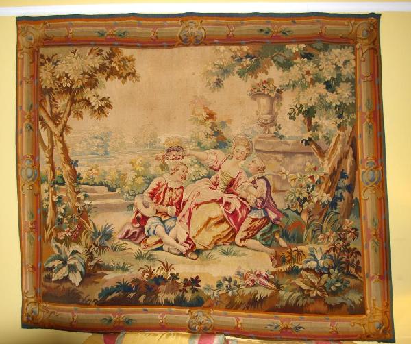 AUBUSSON-STYLE TAPESTRY: depicting figures in a garden scene, probably French, 19thC., 72.5x83.5in.