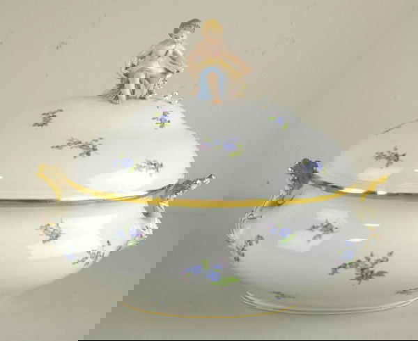 AS-IS MEISSEN FIGURAL COVERED TUREEN: with finial depicting a kneeling child with cornucopia, blue crossed swords mark, chips and losses, 11x14in.