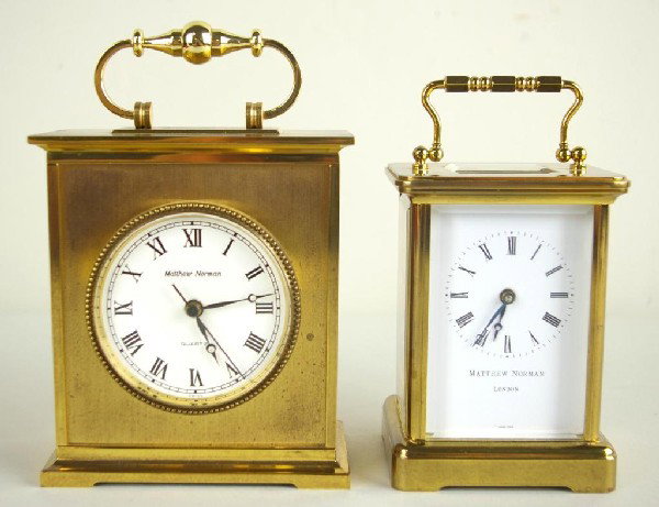 TWO MATTHEW NORMAN BRASS CARRIAGE CLOCKS: each signed on dial, one with works signed 'Movement Matthew Norman Switzerland, 1754, 11 jewels', 8 day movement, the other a quartz movement type, tallest 7in.