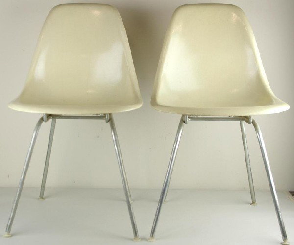 PAIR OF HERMAN MILLER FIBERGLASS CHAIRS: in cream tone, paper label, 31in.