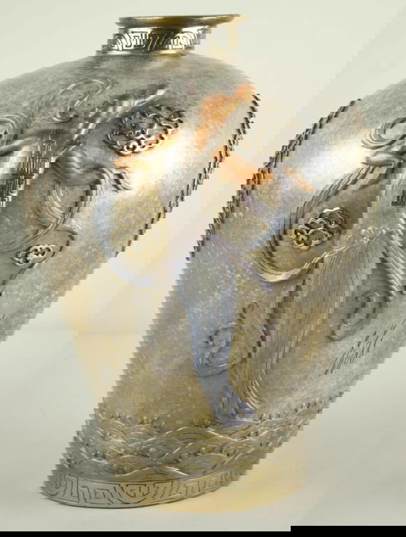 SEVENARTS ERTE BRONZE FIGURAL VASE depicting two d: SEVENARTS ERTE BRONZE FIGURAL VASE depicting two deco-style beauties with design elements in relief, in primarily silver, gold and copper tones, marked "Erte Sevenarts 1990 132/395", 11.5in.