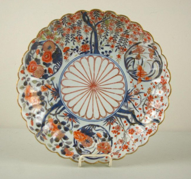 JAPANESE IMARI CHARGER, EDO PERIOD floral decorated: JAPANESE IMARI CHARGER, EDO PERIOD floral decorated, professional repair to a previous crack extending approximately 4" from a scallop edge toward the interior., wear, diameter 13in.