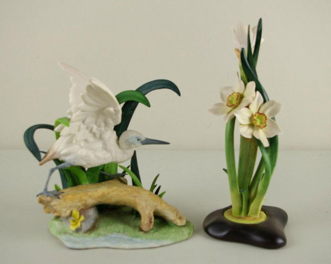 TWO CYBIS FIGURES including a floral example on at: TWO CYBIS FIGURES including a floral example on attached wood base and a blue heron taking flight, tallest 11in.