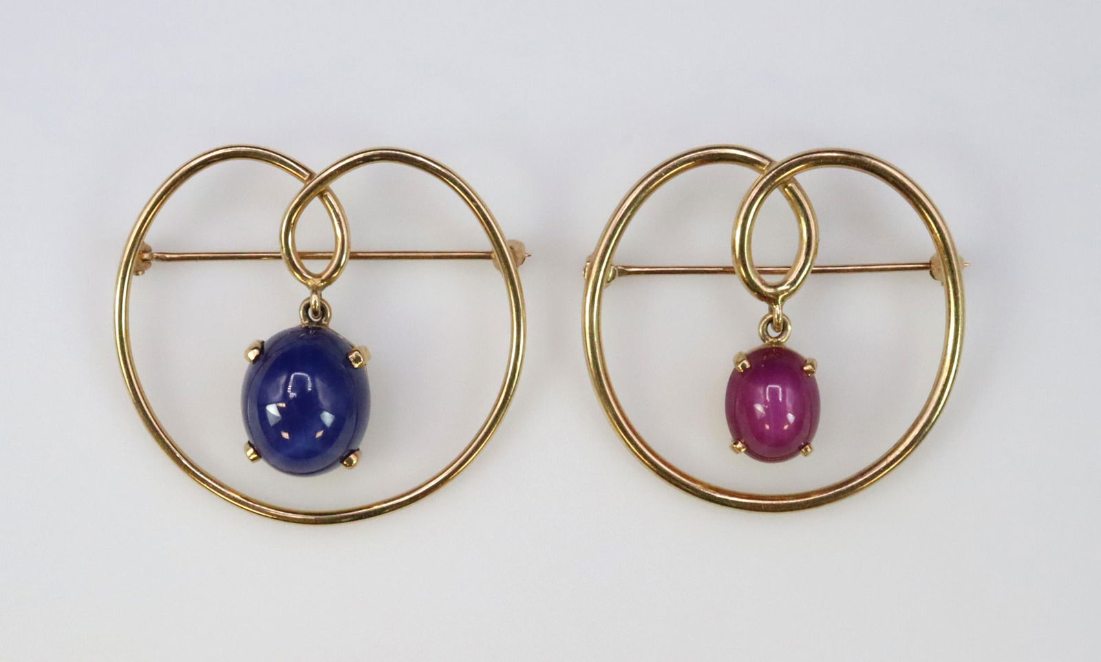 NEAR PAIR 14K SYNTHETIC STAR SAPPHIRE PINS (1 of 2)
