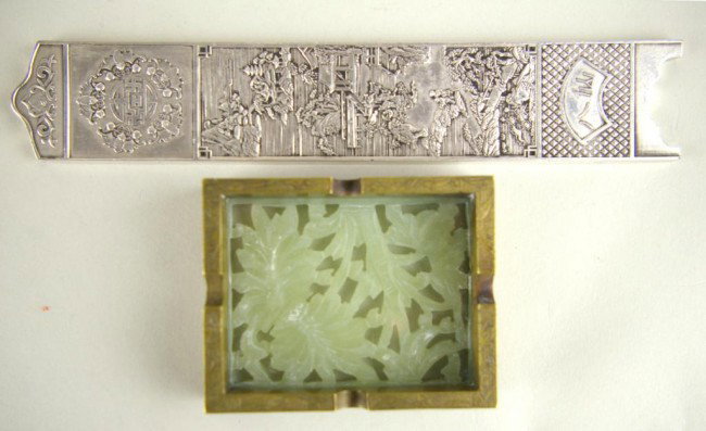 TWO CHINESE OBJECTS: TWO CHINESE OBJECTS including a 3" carved stone and brass ashtray marked China, and a 7" silvertone metal paperweight with figures in landscape and bat decoration, impressed character verso
