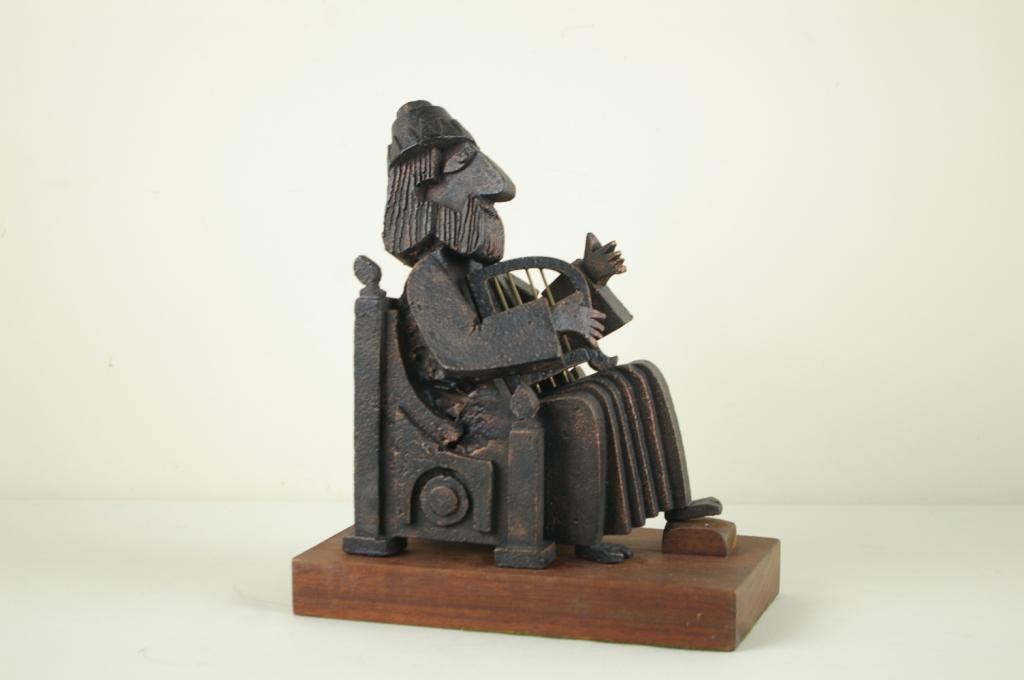 FRANK MEISLER (Israel, 1929-): metal sculpture on wood base of a King sitting on a throne playing a removable harp, pen signed on affixed wood plaque "Frank Meisler, Old Jaffa, Israel, 1975, 62/250", 11x9x5in.