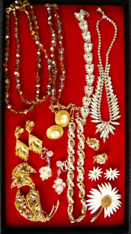 13-PIECE SIGNED COSTUME JEWELRY GROUP: including a Marvella crystal necklace and bracelet, a Weiss rhinestone necklace and bracelet, an Emmons brooch and earclips, a Trifari necklace and earclips, a Pastelli flower pin and earclips, and ea