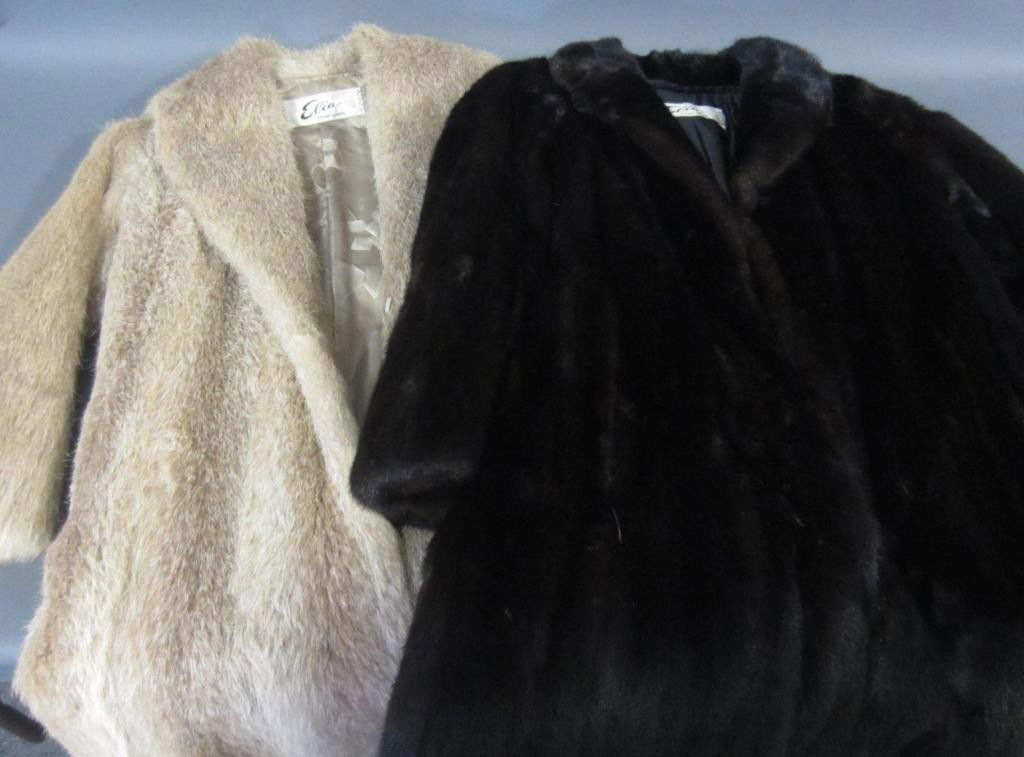 TWO LADIES FUR COATS BY ELIA NEW YORK: one in dark brown, the other a buff leather belted coat, each 3/4 length, each measure 44" length from collar, and 18" width shoulder to shoulder