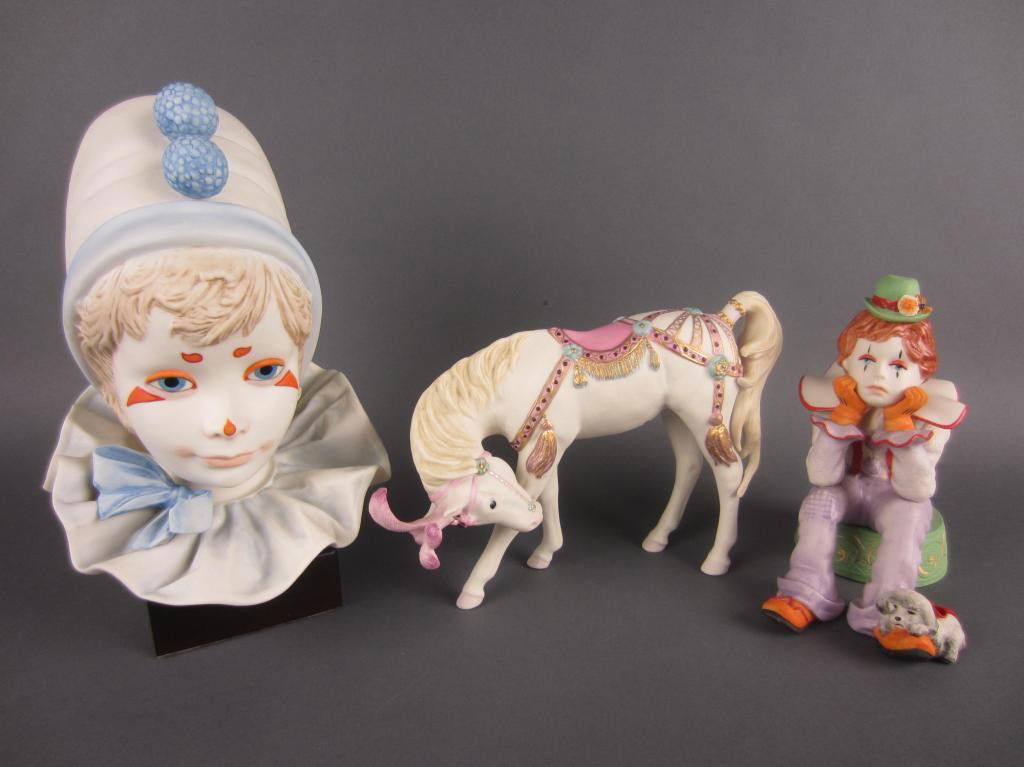 THREE CYBIS PORCELAIN CIRCUS THEMED FIGURES: including a clown bust on attached stand, a seated clown, and a horse (#520), tallest 9in.