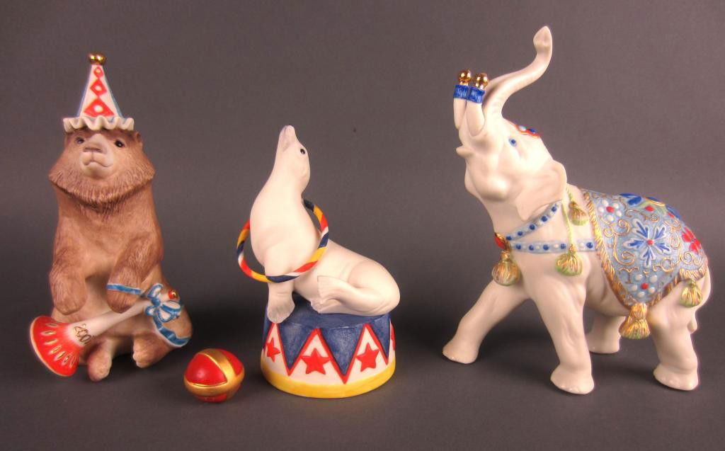 THREE CYBIS PORCELAIN CIRCUS THEMED FIGURES: including a seal, a bear, and an elephant, tallest 7in.