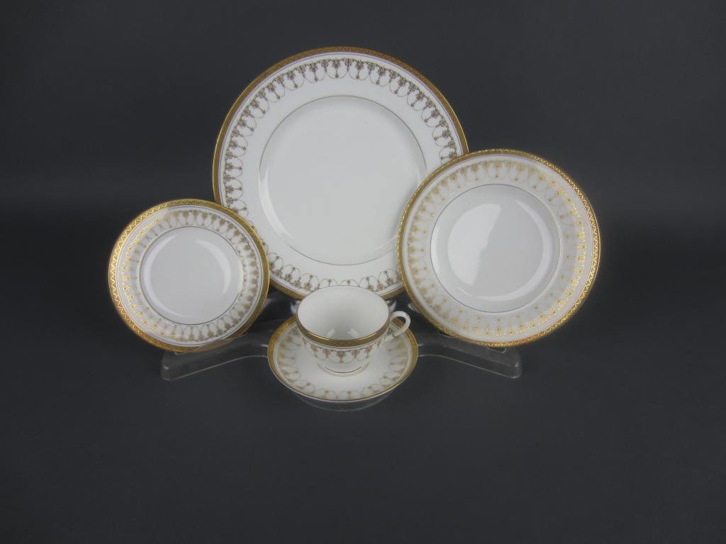 59-PIECE ROYAL WORCESTER IMPERIAL CHINA: comprising 12 each salad plates, bread plates, cups and saucers, and 11 dinner plates, marked, in white with gilt design and rim