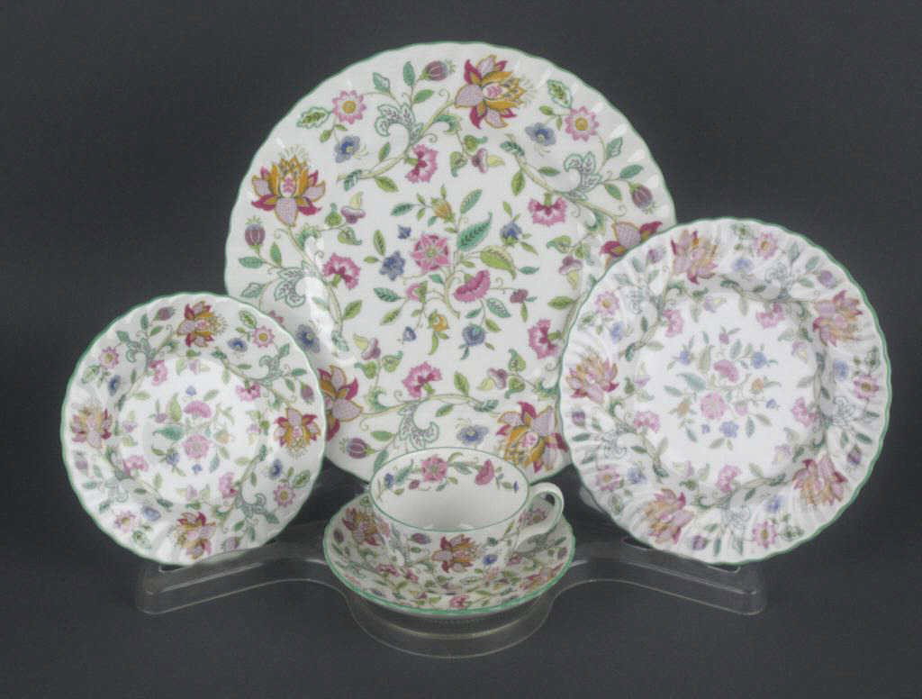69-PIECE MINTON HADDON HALL CHINA: comprising 20 saucers, 14 cups, 12 dinner plates, 11 salad plates, 10 bread plates, and 2 oval-form covered serving bowls, in floral design with scalloped rim