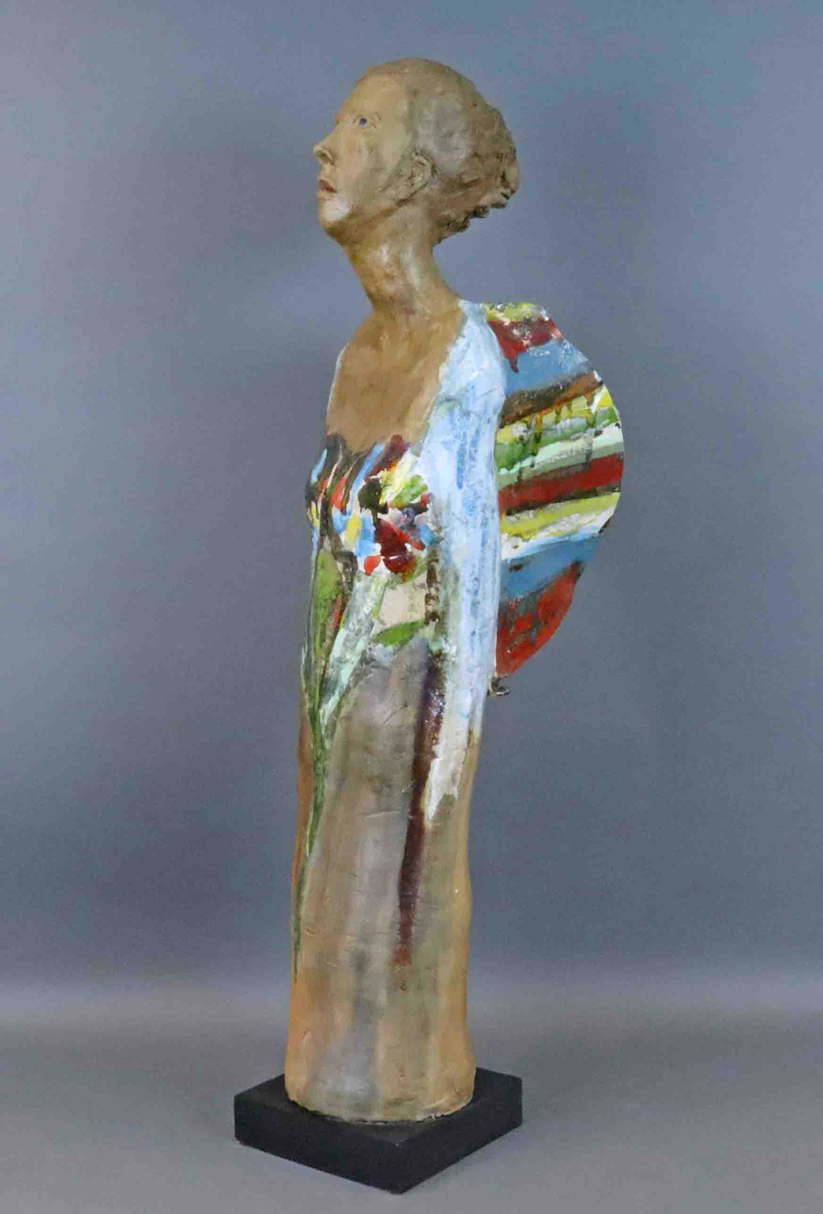 NAIDA SEIBEL (Santa Fe, 20thC.): NAIDA SEIBEL (Santa Fe, 20thC.) winged woman with blue eyes, clay sculpture with colorful metallic glazes, incised 'Naida 78' on verso with copyright, mounted on wood base, no condition issues observe