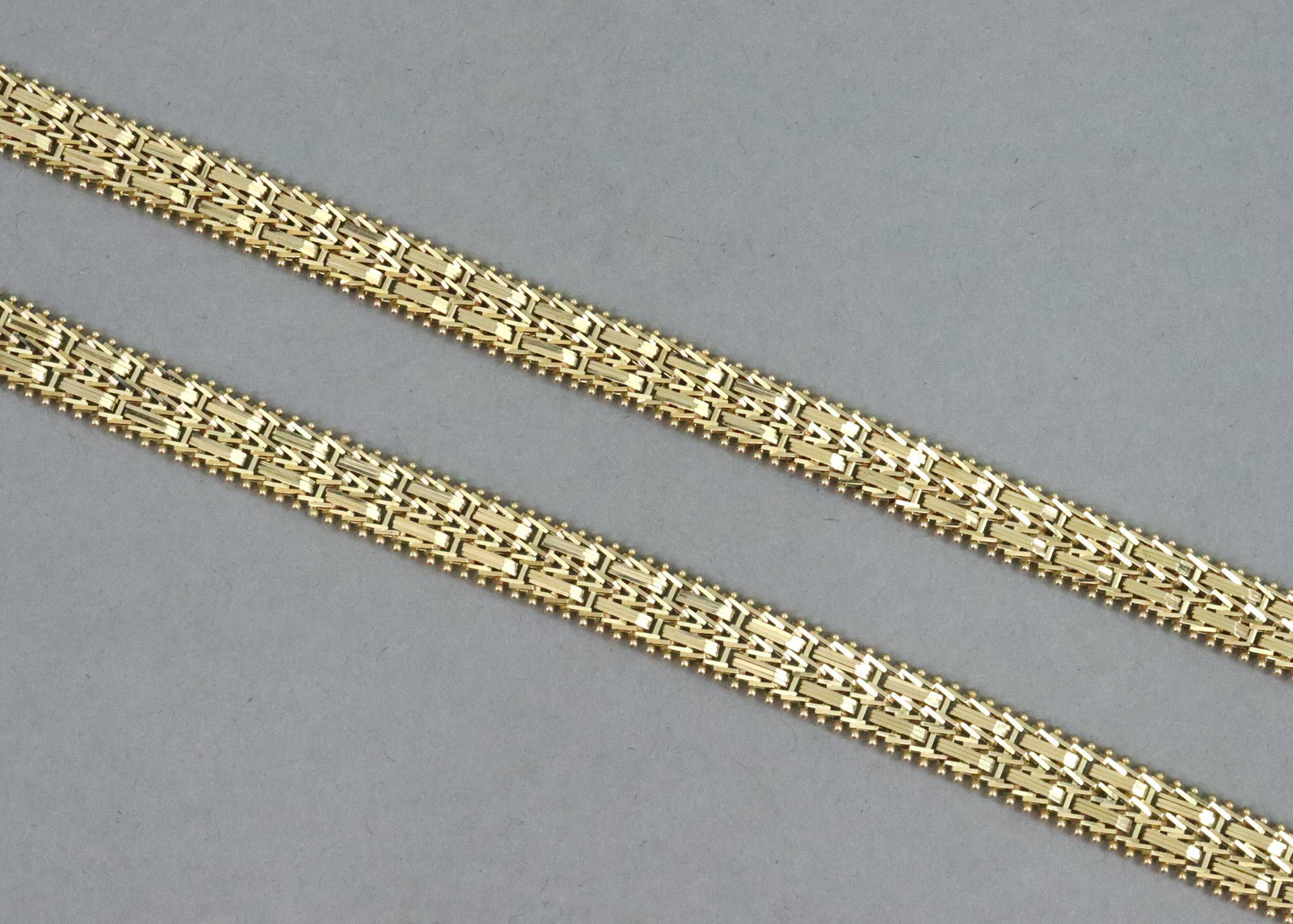 PAIR 14K MIRROR BAR LINK BRACELETS: PAIR 14K MIRROR BAR LINK BRACELETS by Imperial Gold, each stamped 'IG 14K Mexico', height 8mm, length 7.5in., double safety, gross weight 38.4gms., part of an estate collection mainly acquired through
