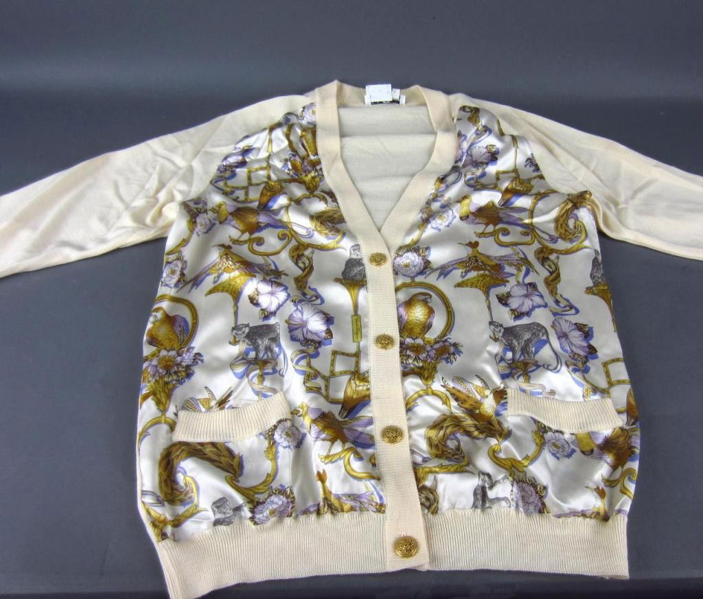 2-PIECE FERRAGAMO SWEATER SET: including a silk blouse in floral, bird, and monkey motif in size 46 with matching silk and wool sweater in size Large