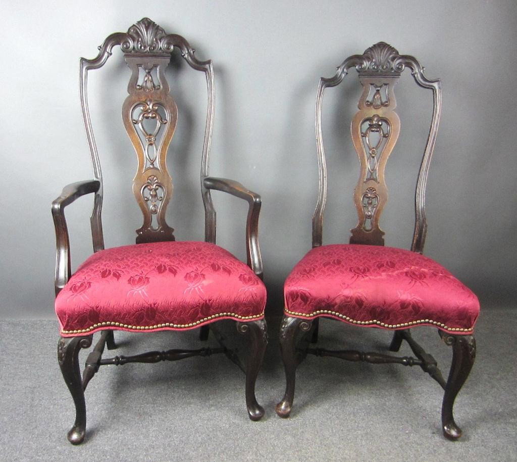 PAIR OF CARVED MAHOGANY FORMAL CHAIRS: in red rose damask seats with nailhead trim, bellflower carved design, one with arms, tallest 50in.