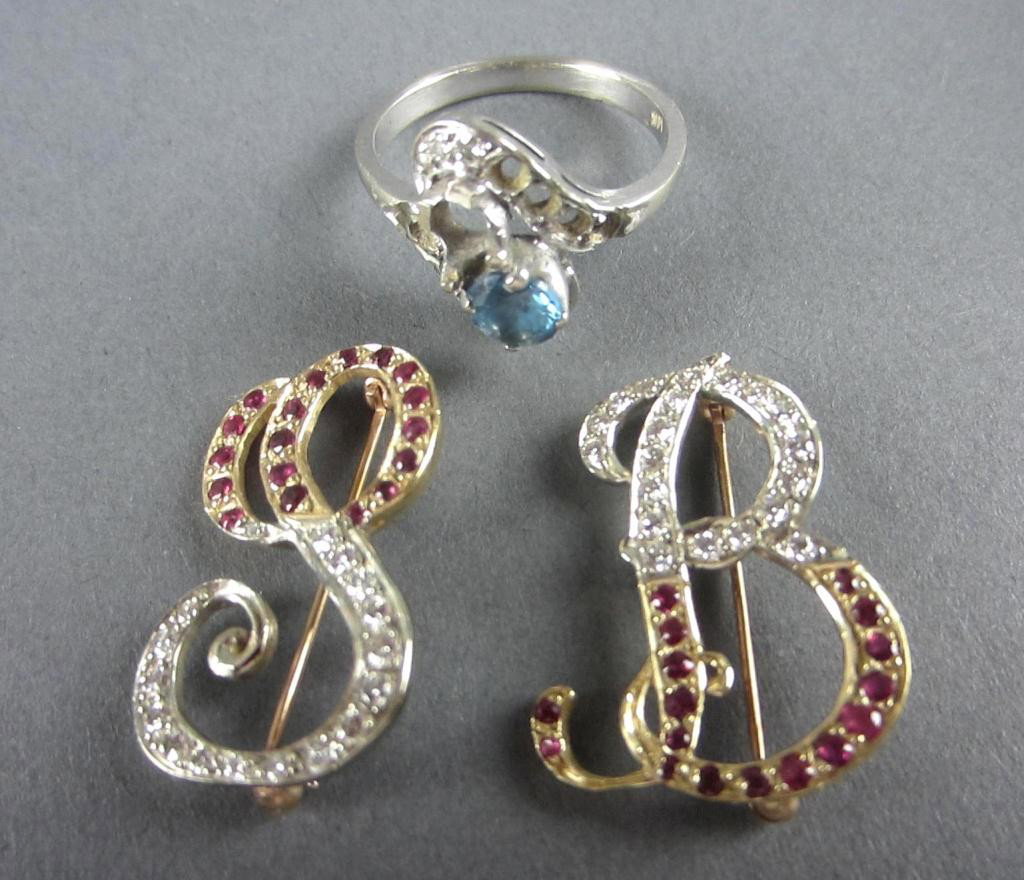 3-PIECE GOLD JEWELRY GROUP: comprising two tested 14K initial pins "B" and "S" accented with diamonds and likely rubies, and a marked 14K blue-stone ring accented with diamond melee (most diamonds missing), 10.8gms.