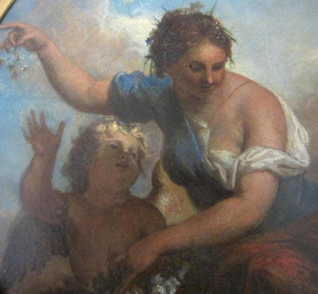 OVAL-FORM ALLEGORICAL PAINTING ON TIN: well executed painting of Venus and Cupid, carved leaf and berry gessoed frame, areas of alligatoring paint, frame losses, 19th century, 15x14in.