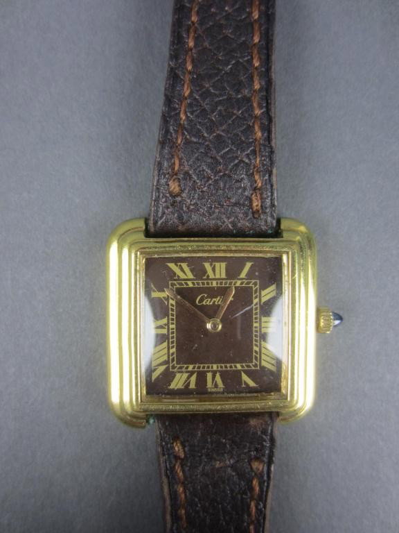 CARTIER LADIES 18K GOLD ELECTROPLATED WATCH: brown dial marked "Cartier" with Roman numerals, pigskin band