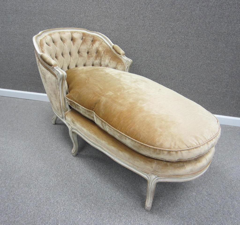 FRENCH-STYLE CHAISE LOUNGE: in champagne tone upholstery with tufted back and padded arms, white distressed-painted frame, 30x54in.