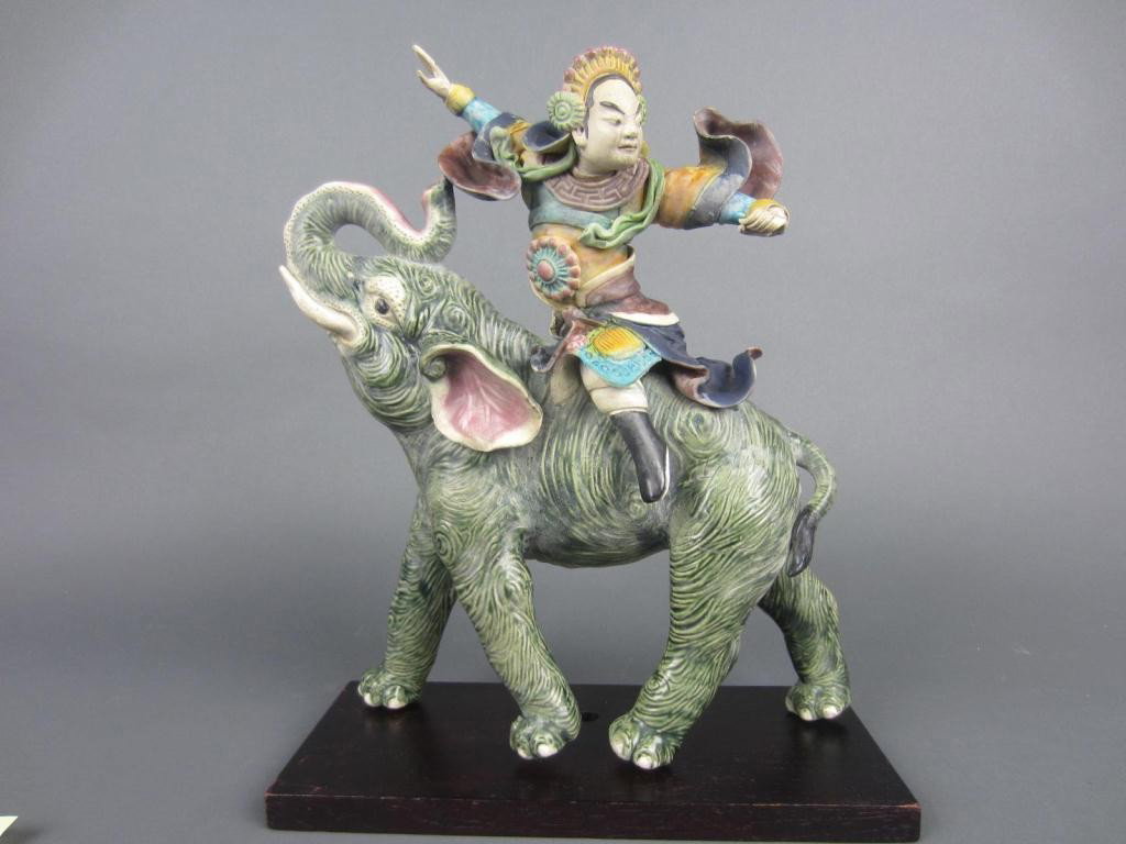 CHINESE ELEPHANT AND WARRIOR ROOF TILE: loss to warrior headpiece, 14x13in.